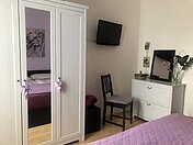Ein Schlafzimmer in der Fewo Dresden-City-1